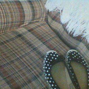 A Pair Of Black and White Polka Dot Loafers